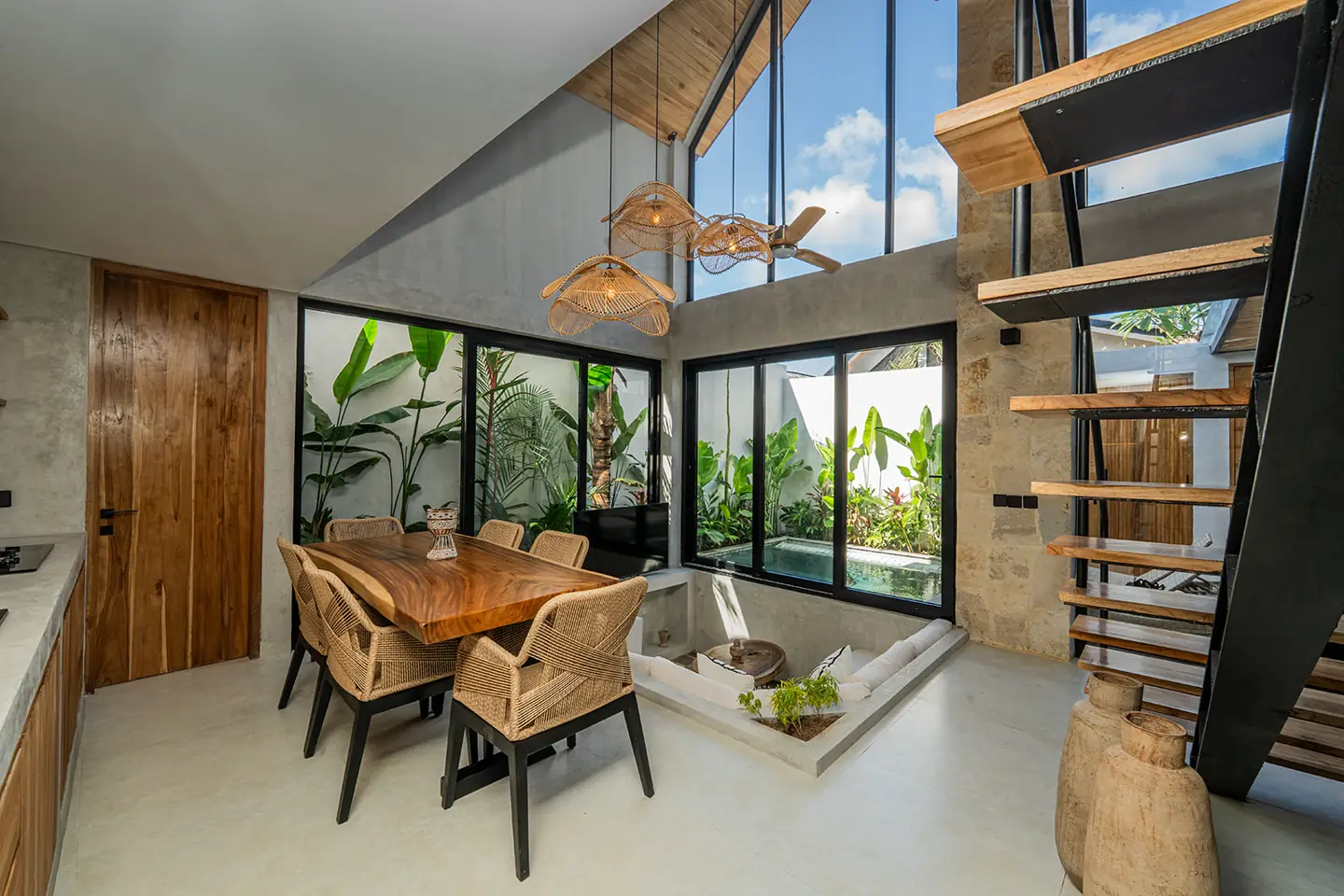 Double-height living and dining space in a tropical Bali villa